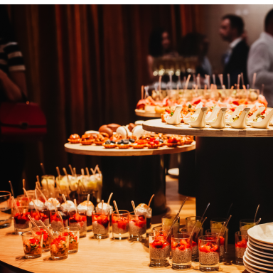 A variety of decorative desserts and sweet dishes on display at an event.